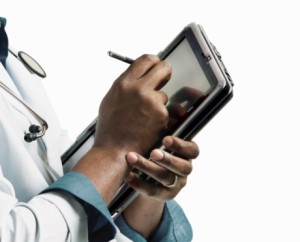 Doctor writing in an electronic notepad